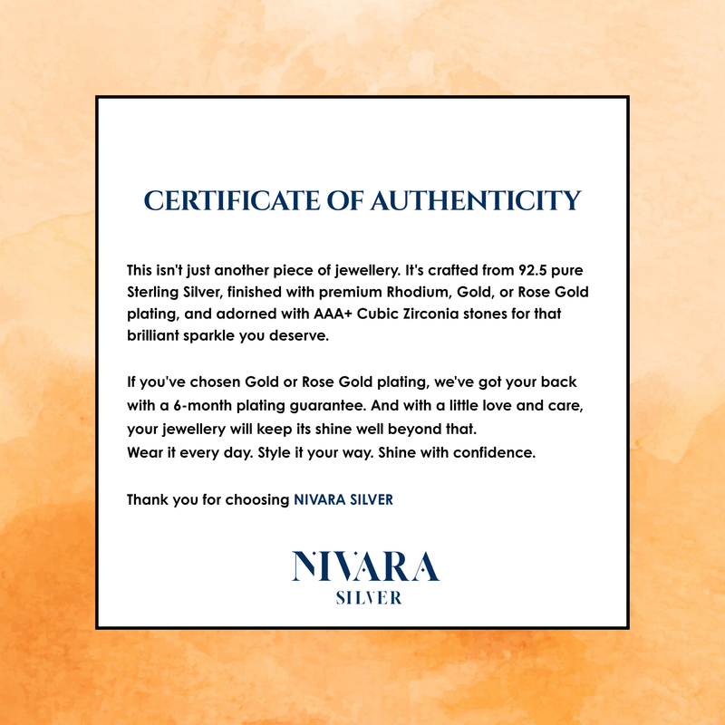 A certificate of authenticity card for Nivara Silver jewelry, detailing the materials and guarantees, set against a textured orange background.