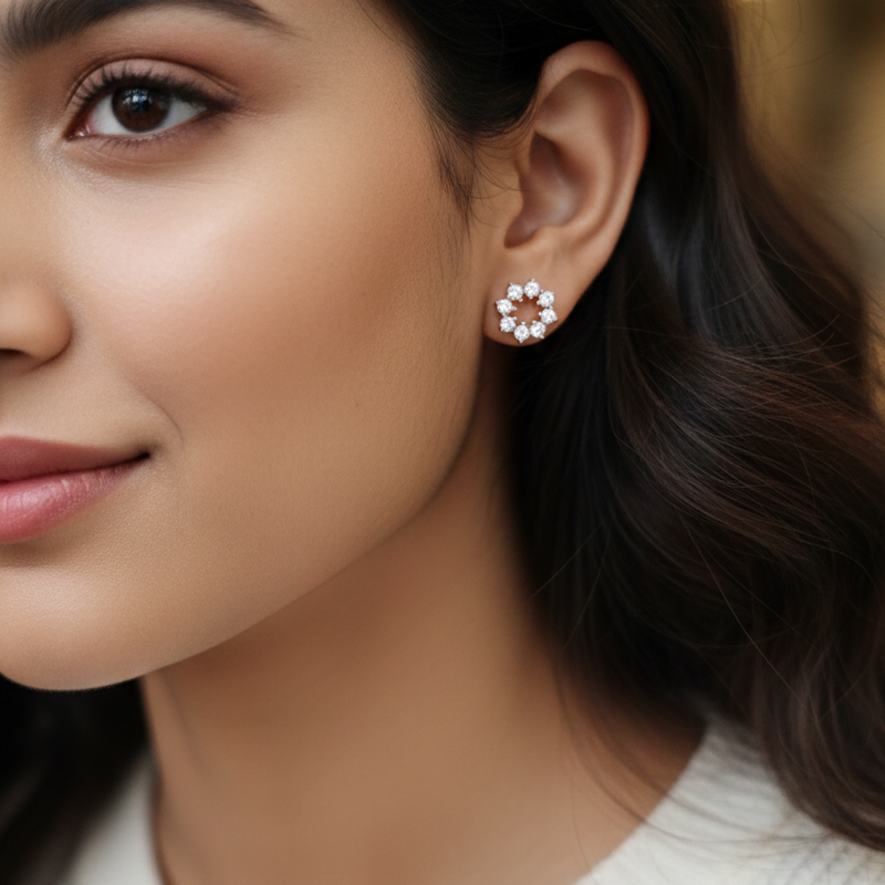 Close-up of a woman wearing a floral earring with a blurred background